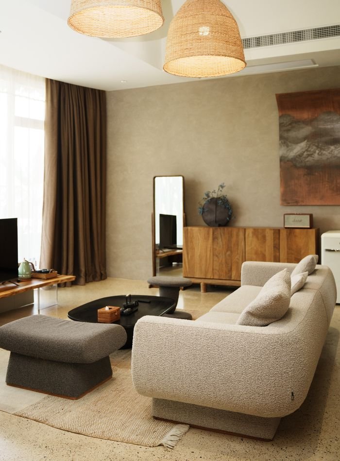 A modern cozy living room featuring plush furniture and elegant decor, perfect for relaxation.